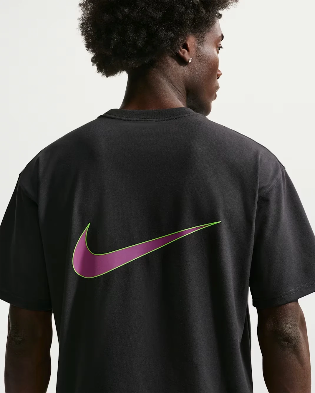 Back view of the Nike Kobe Dri-FIT M90 black T-shirt with fuchsia and lime Swoosh graphic