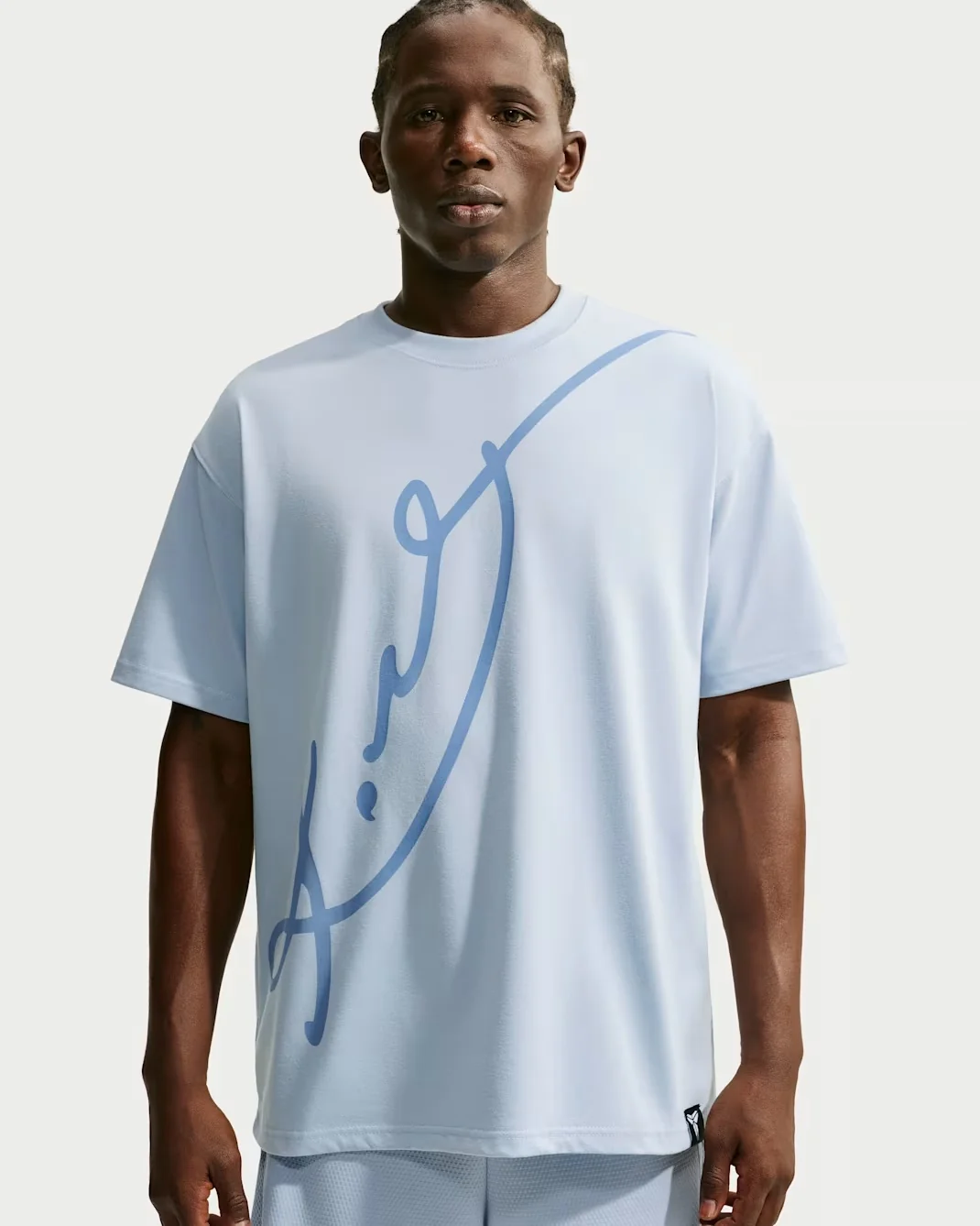 Light blue Nike Kobe Mamba Mentality T-shirt with oversized blue graphic.