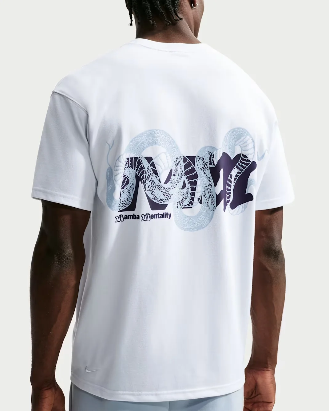 Back of white Nike Kobe Mamba Mentality T-shirt with light blue and black snake graphic.