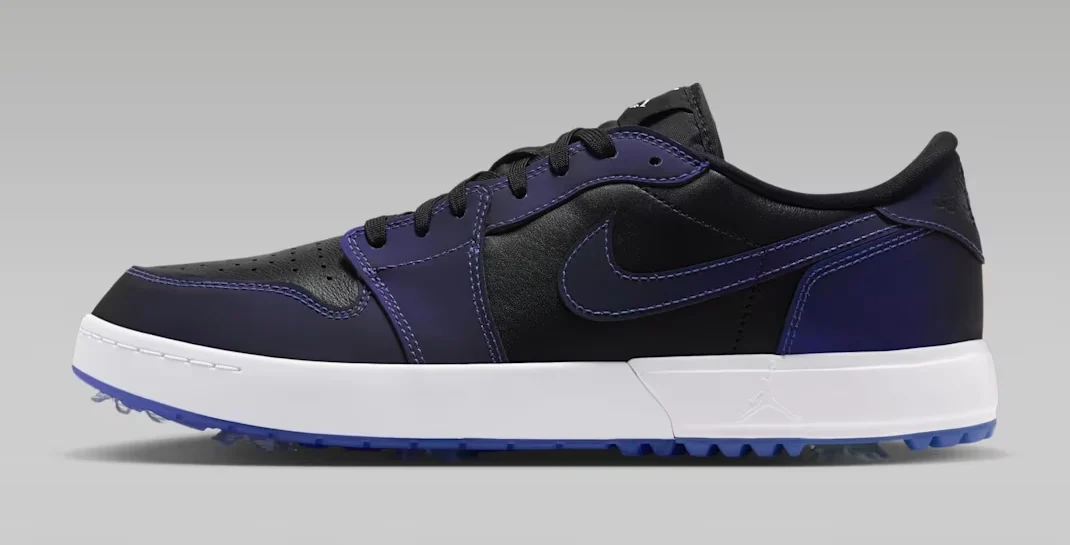 Air Jordan 1 Low Golf Spiked Space Jam Release Date shoe featuring a black leather upper, dark purple overlays, matching Nike Swoosh, white midsole and blue spiked golf outsole, shown from the side.