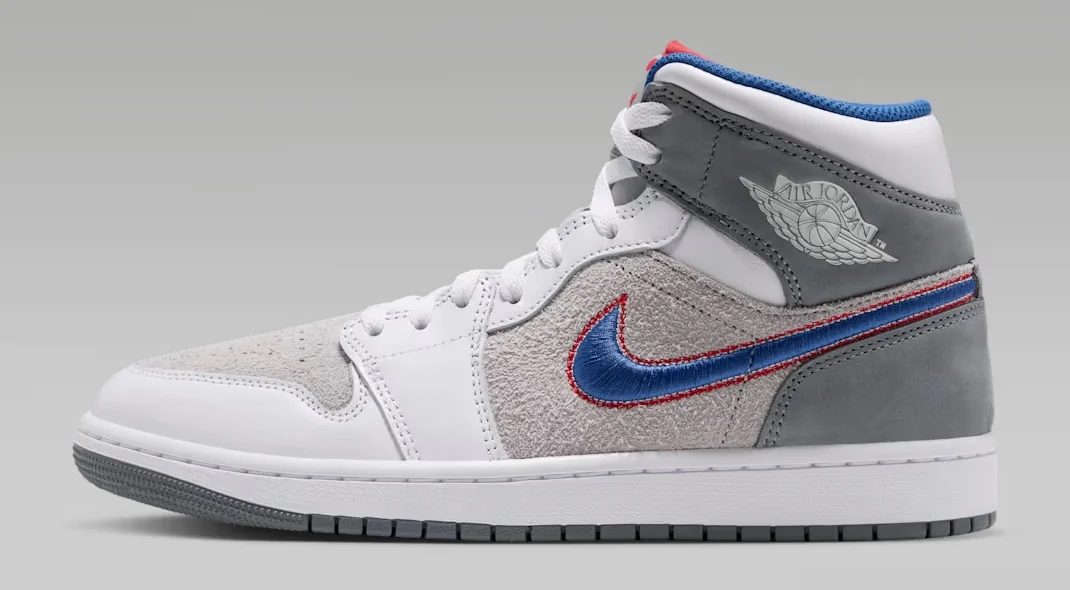 Air Jordan 1 Mid SE Space Jam Hare sneaker featuring white leather, grey suede, a blue Nike Swoosh with red stitching and Air Jordan Wings branding.