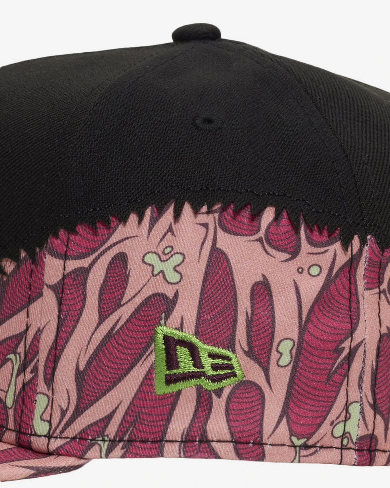 Close-up of New Era Brains 9FIFTY snapback hat with pink and burgundy brain graphics, lime green New Era logo and black crown, a match for the Air Jordan 5 Halloween.