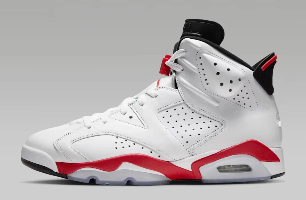 Air Jordan 6 White Infrared 2026 sneakers featuring white leather, black detailing and Infrared accents.