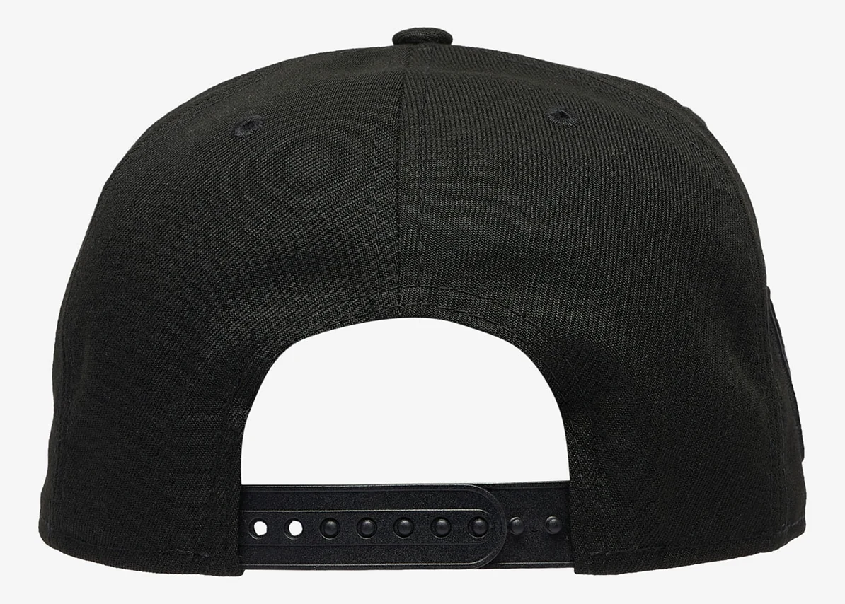 Rear view of black New Era Chicago Bulls snapback hat showing adjustable black closure, coordinating with the Air Jordan 6 White Infrared sneakers.