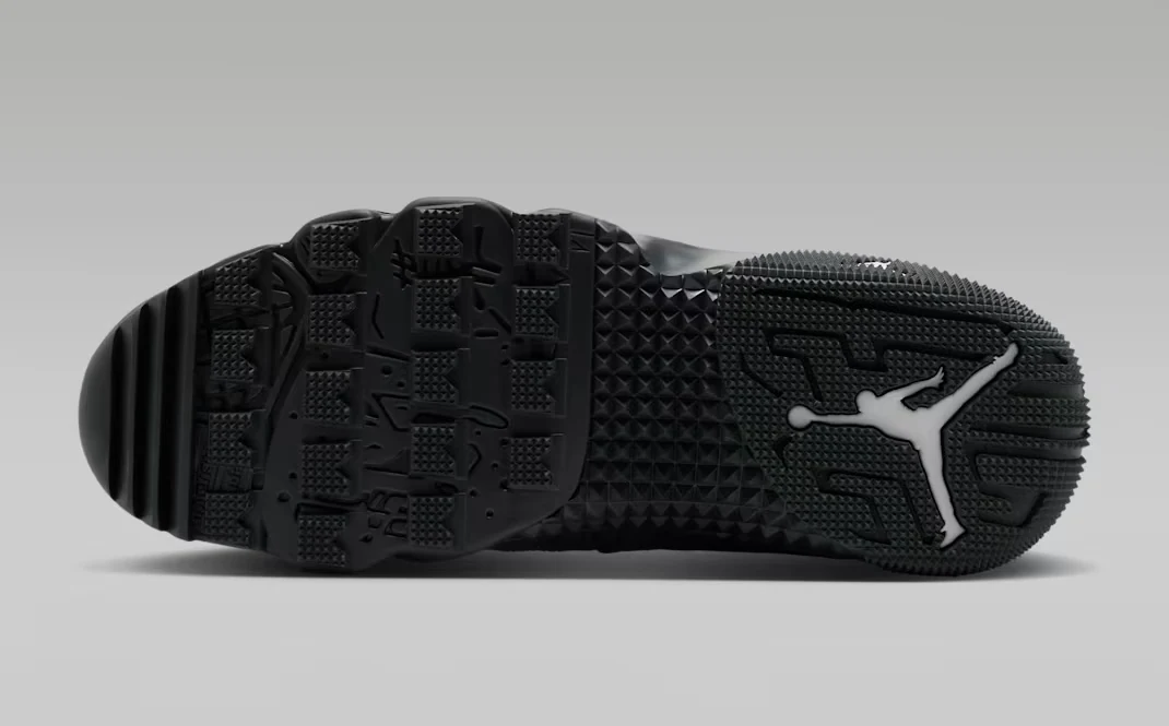 Bottom view of the Air Jordan 9 Retro Boot Anthracite Reflective showing the black traction outsole and white Jumpman logo.