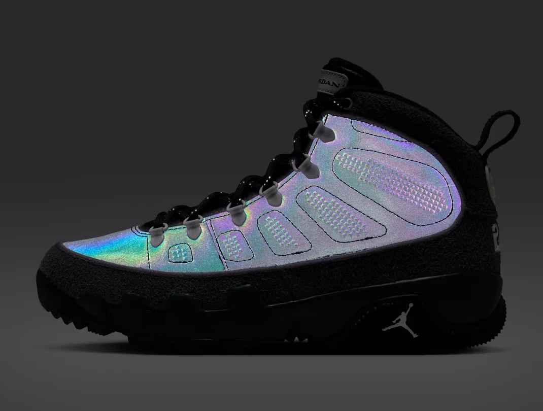 Air Jordan 9 Retro Boot Anthracite Reflective showing multicolor iridescent reflective panels against a dark background.