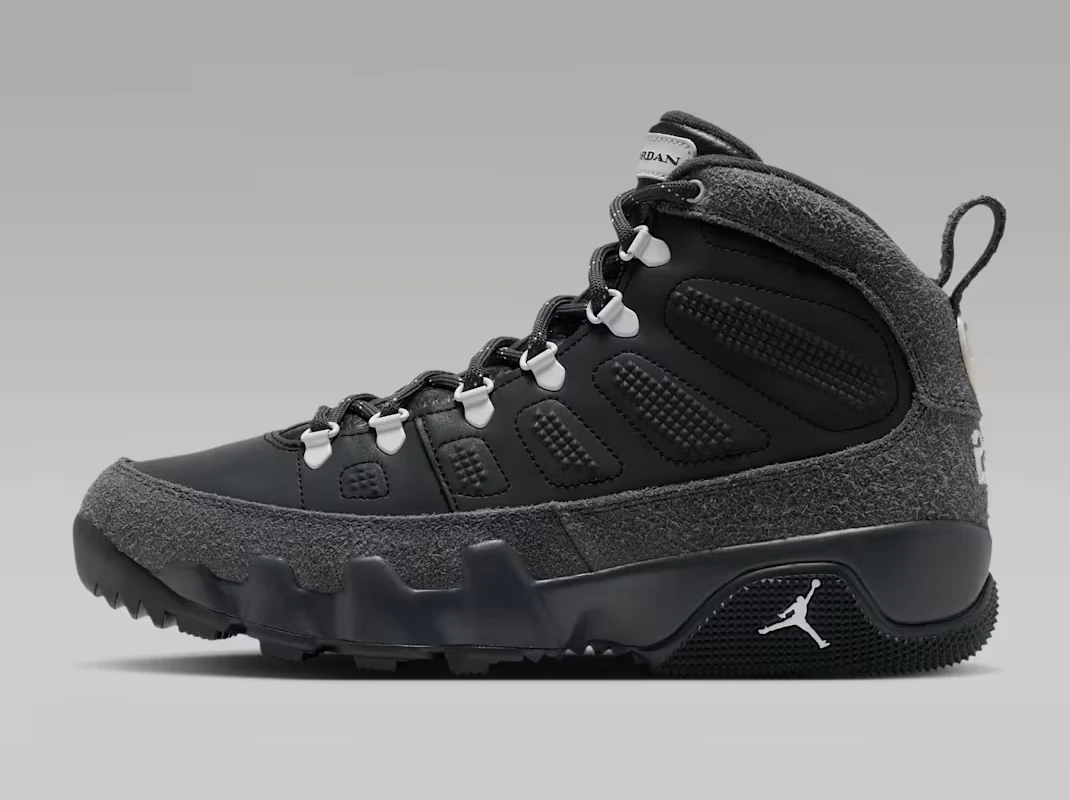 Lateral side view of the Air Jordan 9 Retro Boot Anthracite Reflective with black upper, grey textured overlays and white Jumpman logo.