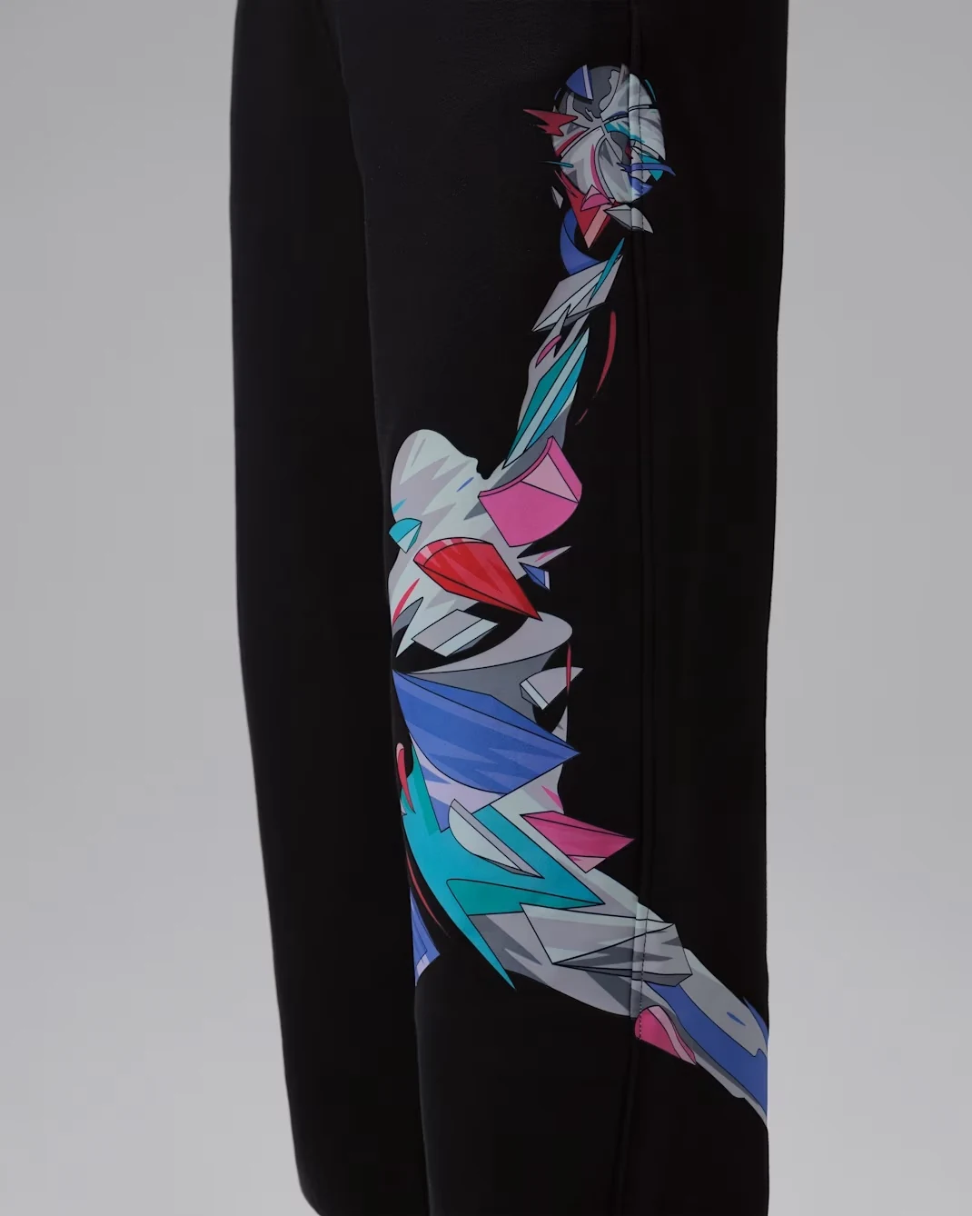 Detail of Jordan Brooklyn Art Series graphic fleece pants in black with multicolor artwork