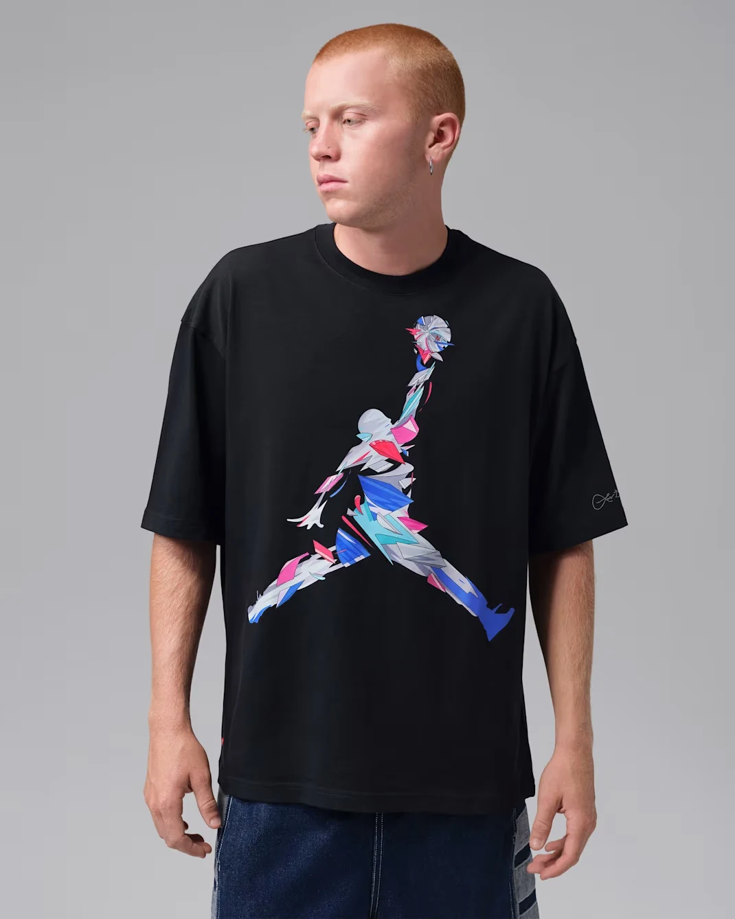 Front view of Jordan Brooklyn Art Series oversized graphic T-shirt in black with multicolor artwork