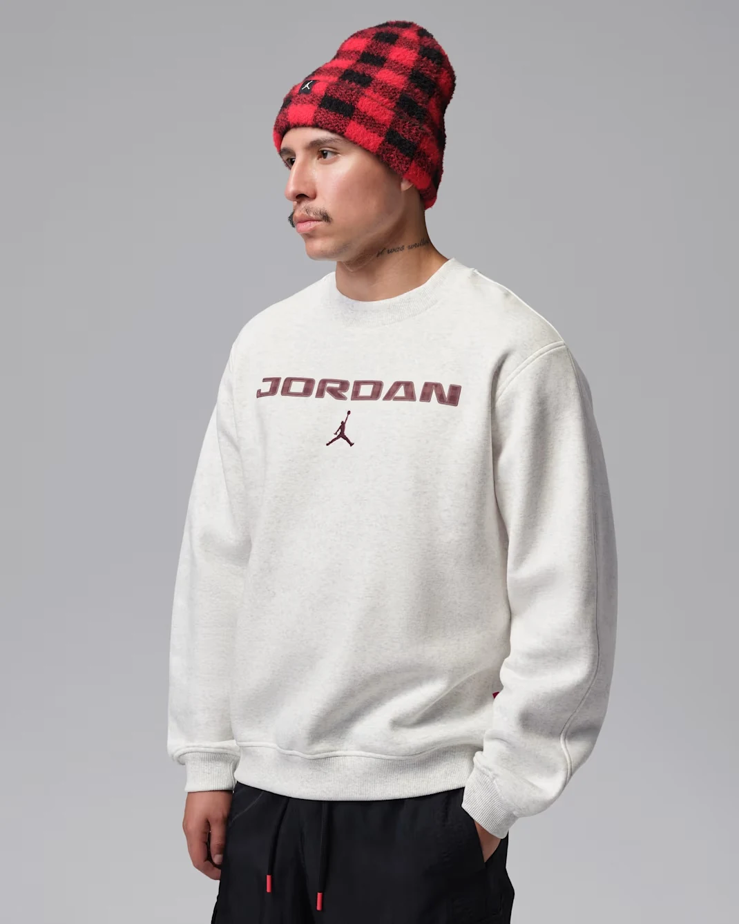 Model wearing Sail Jordan Brooklyn fleece crew sweatshirt with brown Jordan lettering