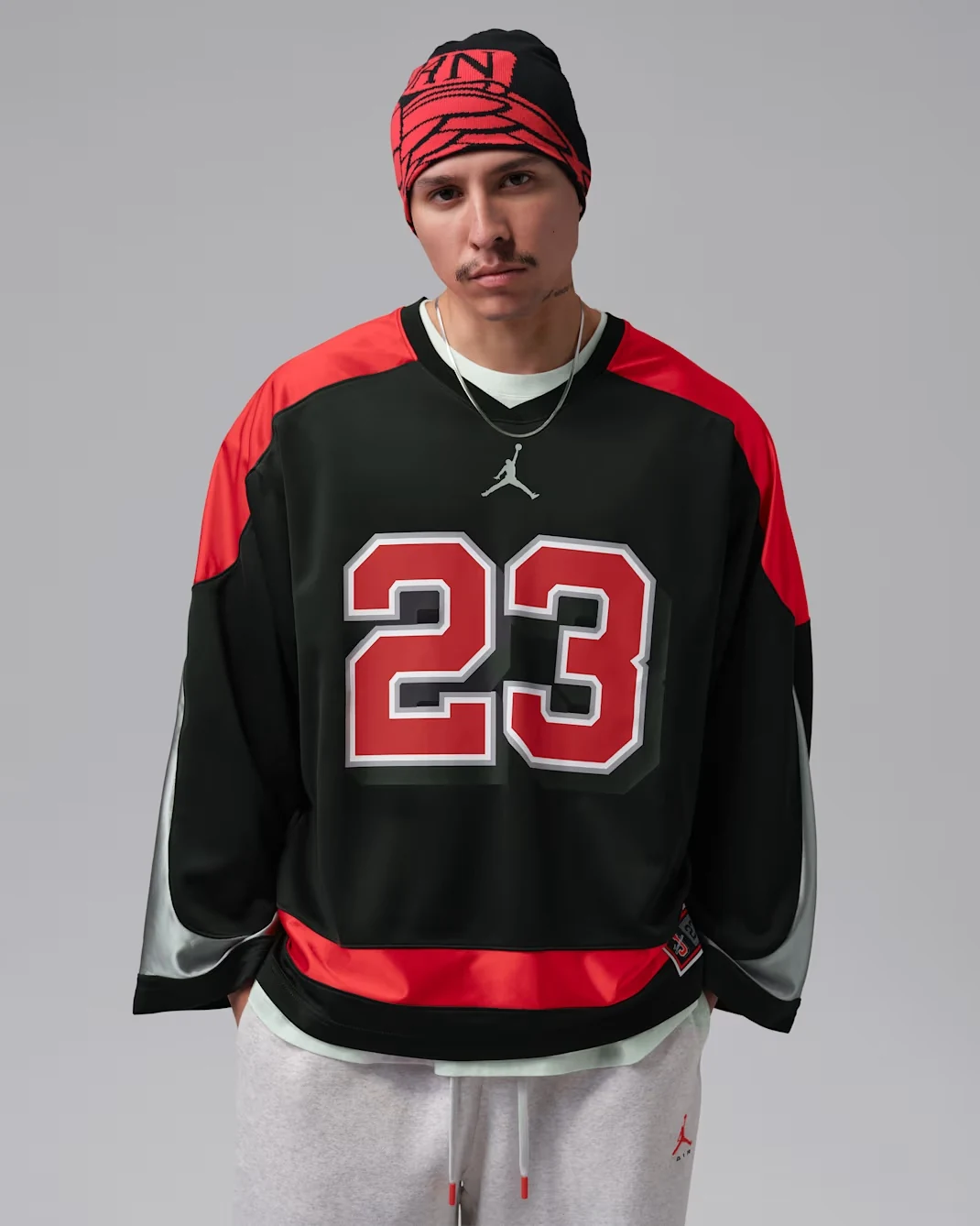 Front of black and red Jordan Brooklyn hockey jersey with large number 23 graphic