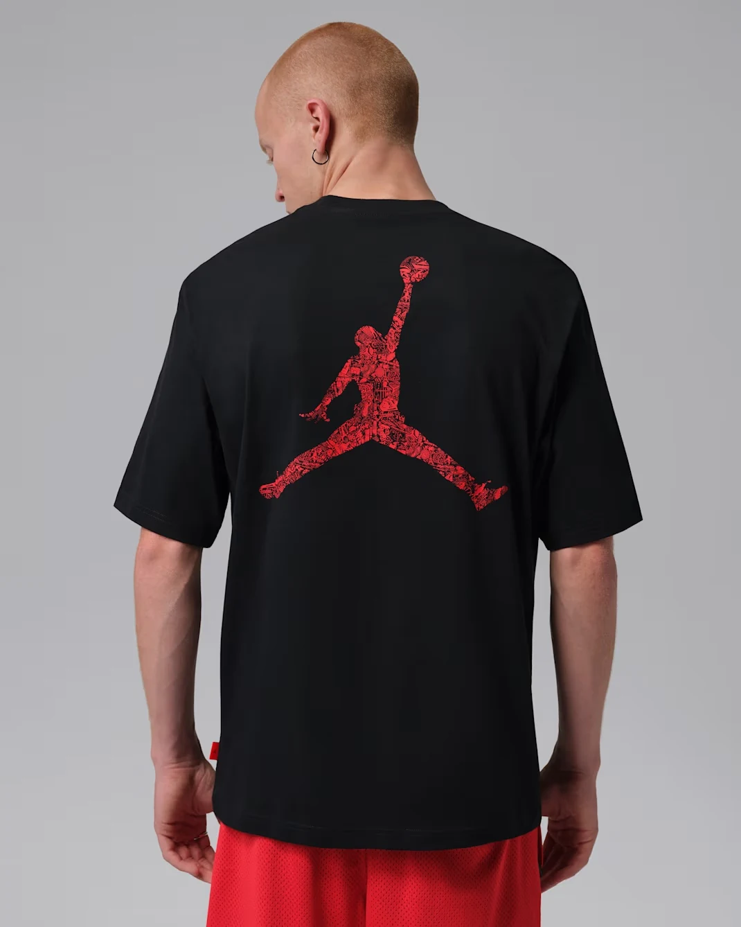 Jordan Brooklyn Men's Graphic T-Shirt in Black with large University Red Jumpman graphic on the back