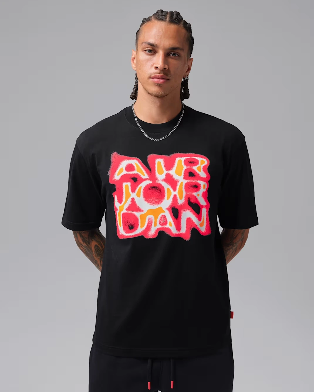 Black Jordan Brooklyn men's graphic T-shirt with pink-red and orange lettering to match the Air Jordan 5 “Sunset”