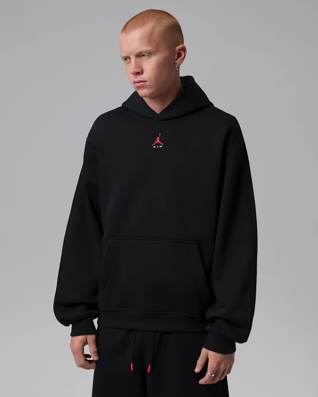 Black Jordan Brooklyn pullover hoodie with small red Jumpman Air chest logo