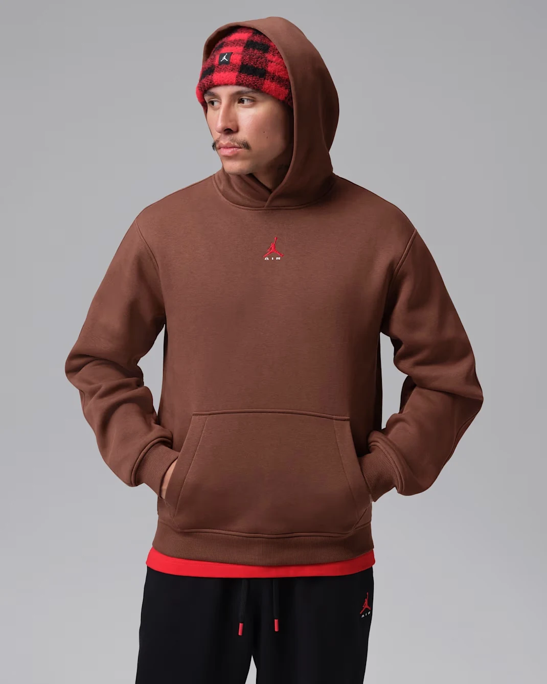 Front view of Fauna Brown Jordan Brooklyn pullover hoodie with red Jumpman logo