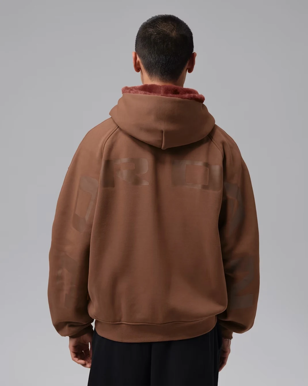 Back view of Fauna Brown Jordan Flight full-zip hoodie with tonal Jordan graphics
