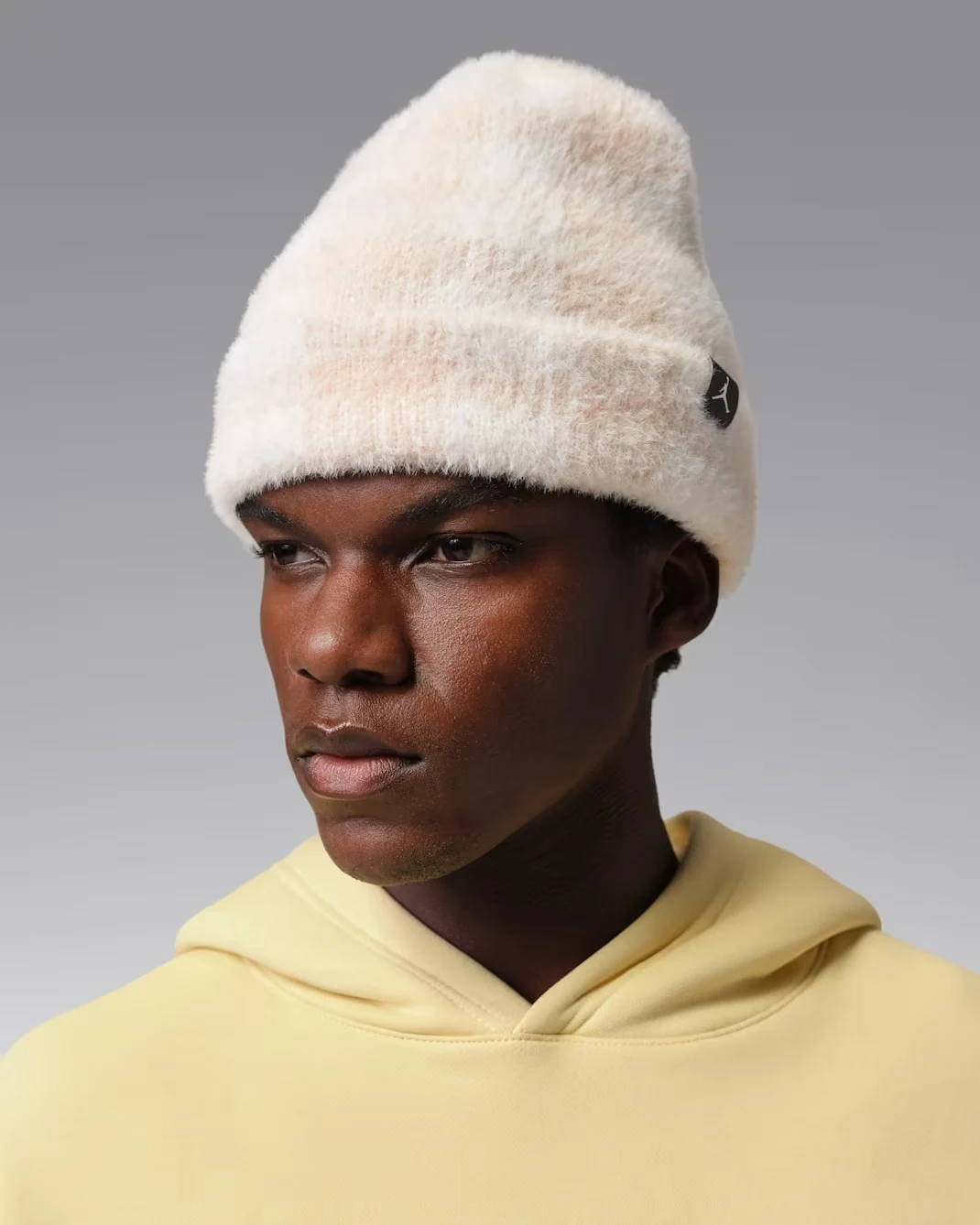 Model wearing Sail Jordan Peak beanie with fuzzy knit texture and Jumpman patch