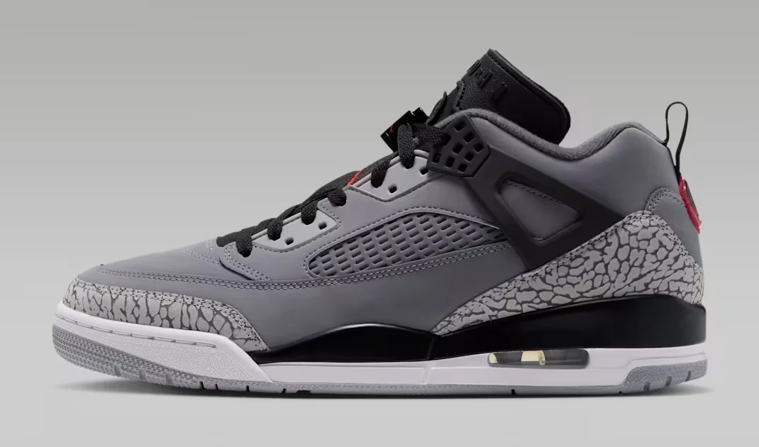 Jordan Spizike Low Cool Grey Black sneaker featuring grey leather, black accents, elephant-print overlays and a white midsole, shown from the side.