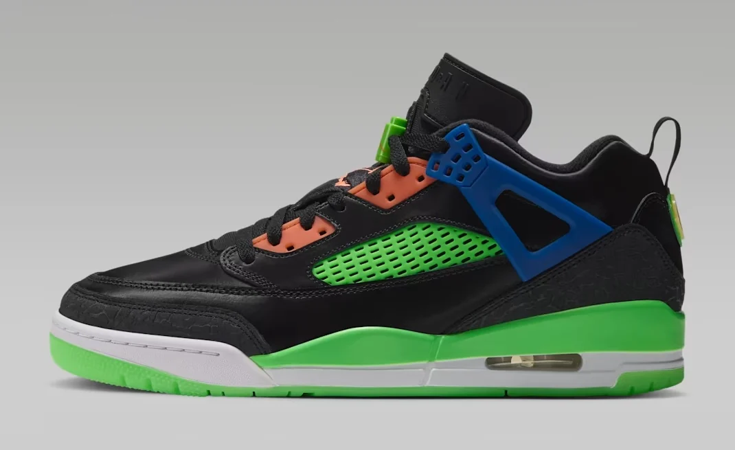 Jordan Spizike Low Jam Central Space Jam Release Date sneaker featuring a black upper, bright green mesh panels, blue accents, orange lace eyelets and green midsole, shown from the side.