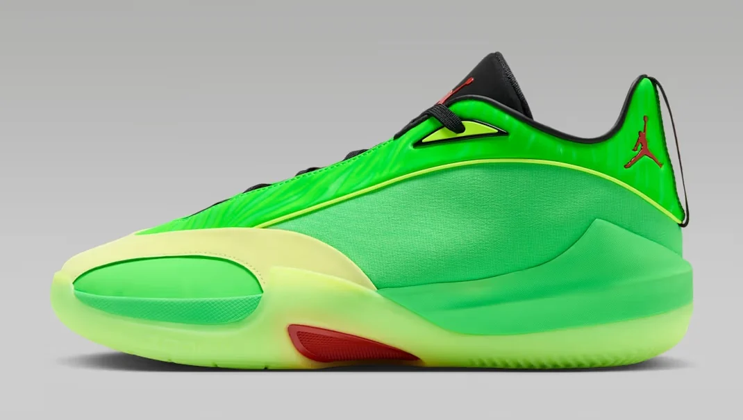 Jordan Triangle Paolo basketball shoe featuring a bright green upper, neon yellow accents, black tongue and red Jumpman logo, shown from the side.