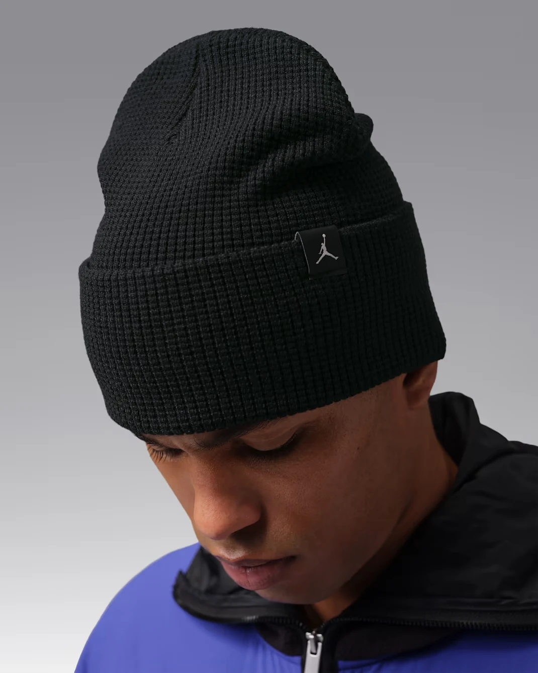 Model wearing a black Jordan Waffle Beanie with textured waffle-knit fabric, folded cuff and Jumpman logo patch.