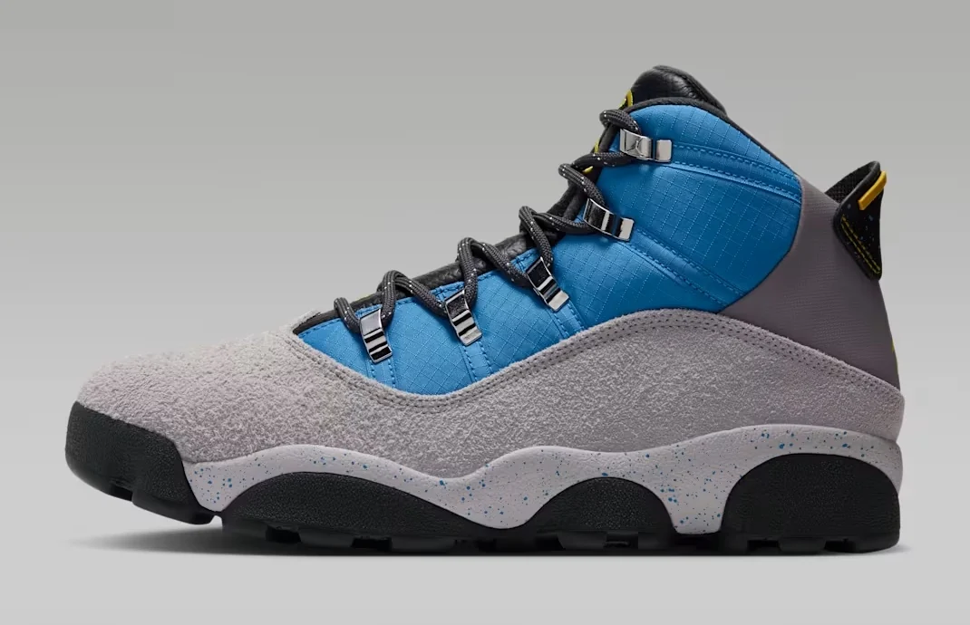 Jordan Winterized 6 Rings Cobalt Blue Vast Grey sneaker featuring a blue upper, grey suede overlays, black laces and a speckled midsole, shown from the side.