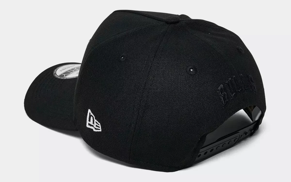 Rear angled view of black New Era Chicago Bulls Space Galaxy 9FORTY A-Frame hat showing adjustable snapback closure and white New Era logo.