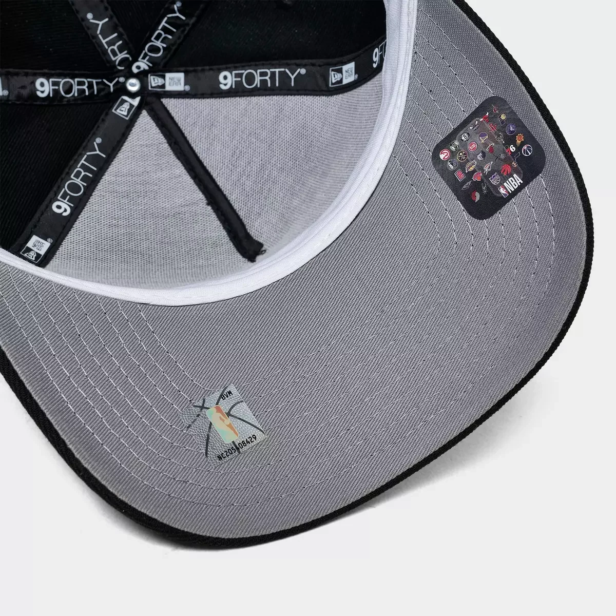 Inside view of New Era Chicago Bulls Space Galaxy 9FORTY A-Frame hat showing gray underbrim, black interior taping and NBA label.