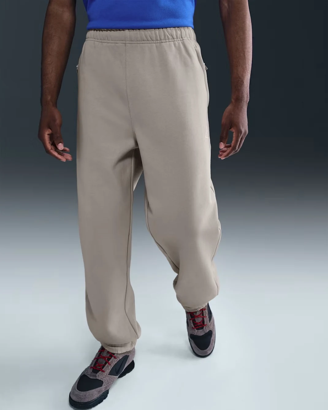 Nike ACG Tuff Fleece pants in College Grey and Summit White with relaxed fit