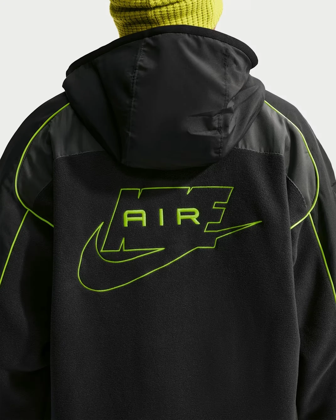 Nike Air Polartec Therma-FIT black track jacket with Volt green Nike Air graphic and Swoosh on the back.