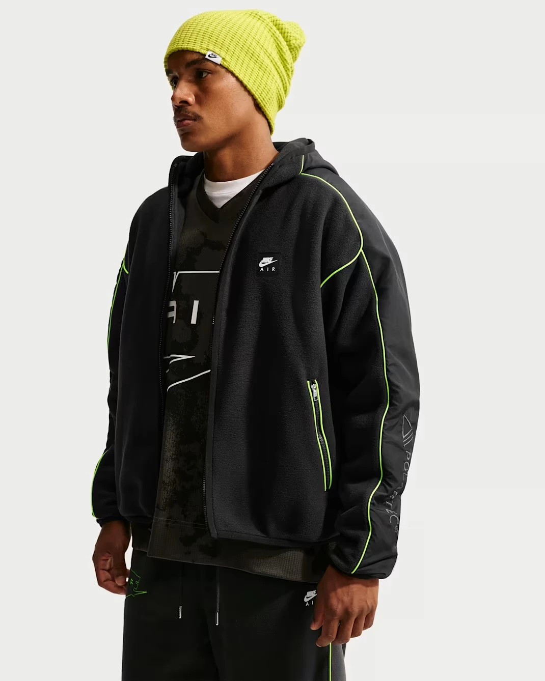 Nike Air Polartec Therma-FIT black full-zip track jacket with Volt green piping and Nike Air chest logo.