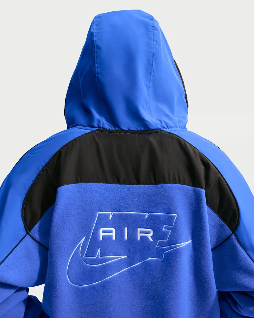 Back detail of royal blue and black Nike Air Polartec Therma-FIT hooded track jacket with embroidered Nike Air logo
