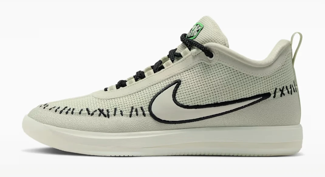 Side view of the Nike Book 2 Scary Chapter Halloween basketball shoe in light bone with black stitching and laces.