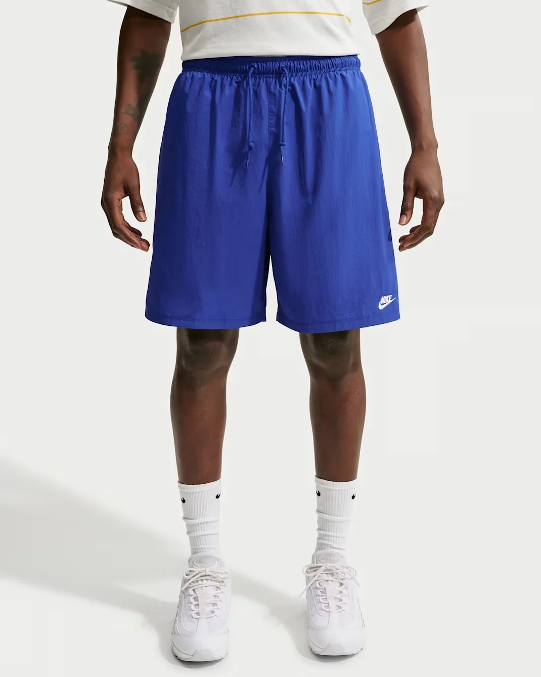Royal blue Nike Club sport shorts with elastic drawstring waistband and white Nike logo