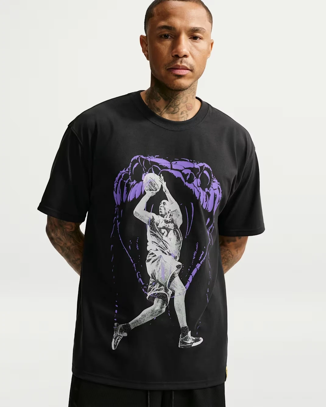 Black Nike Kobe Dri-FIT basketball T-shirt with purple and white graphics.