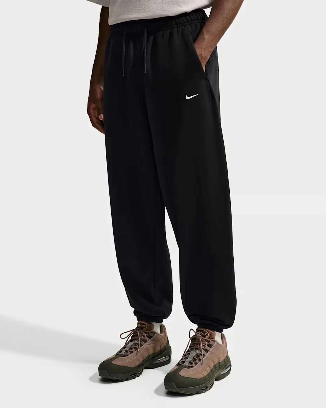 Nike Solo Fleece cuffed pants in Black and White