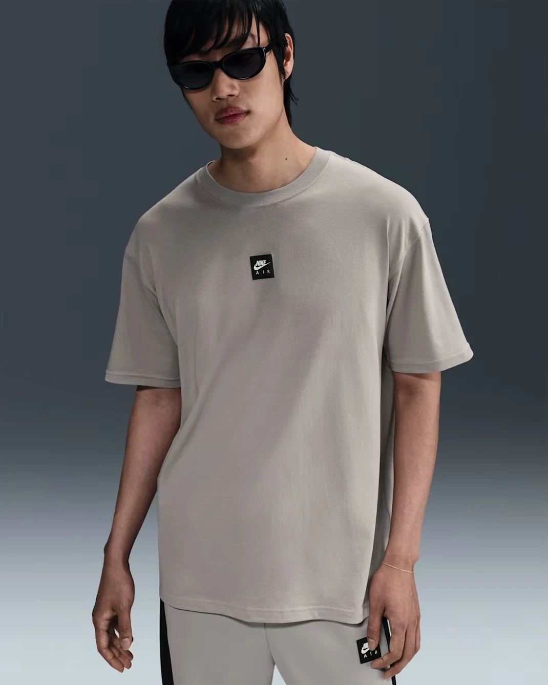 Front view of Nike Sportswear Max90 T-shirt in College Grey with small Nike Air chest graphic