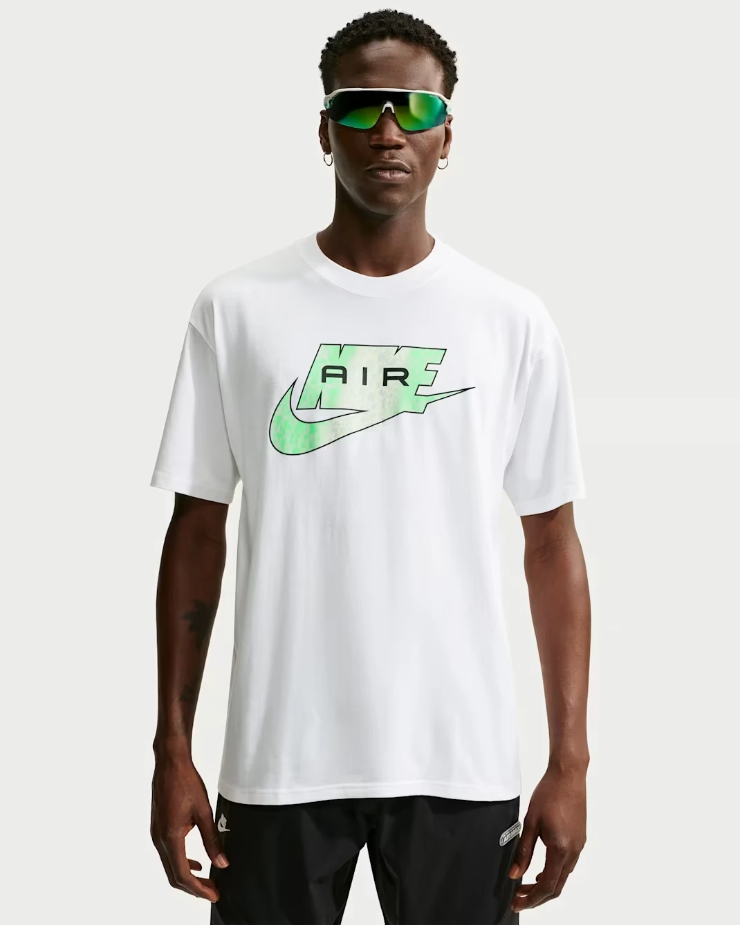 Nike Sportswear men's white T-shirt with green Nike Air graphic and Swoosh across the chest.