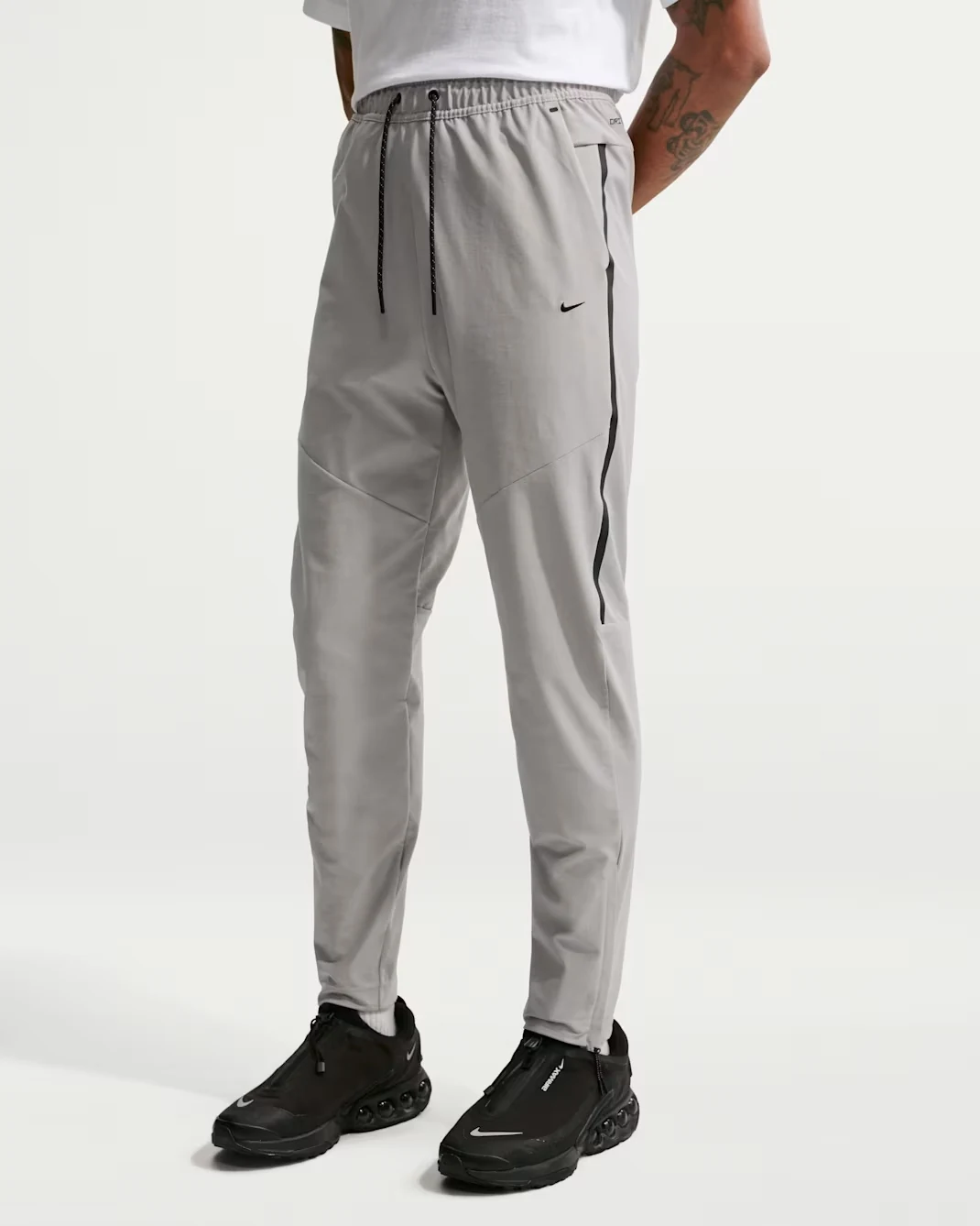 Nike Tech men's Dri-FIT Shori Knit pants in College Grey with Black accents