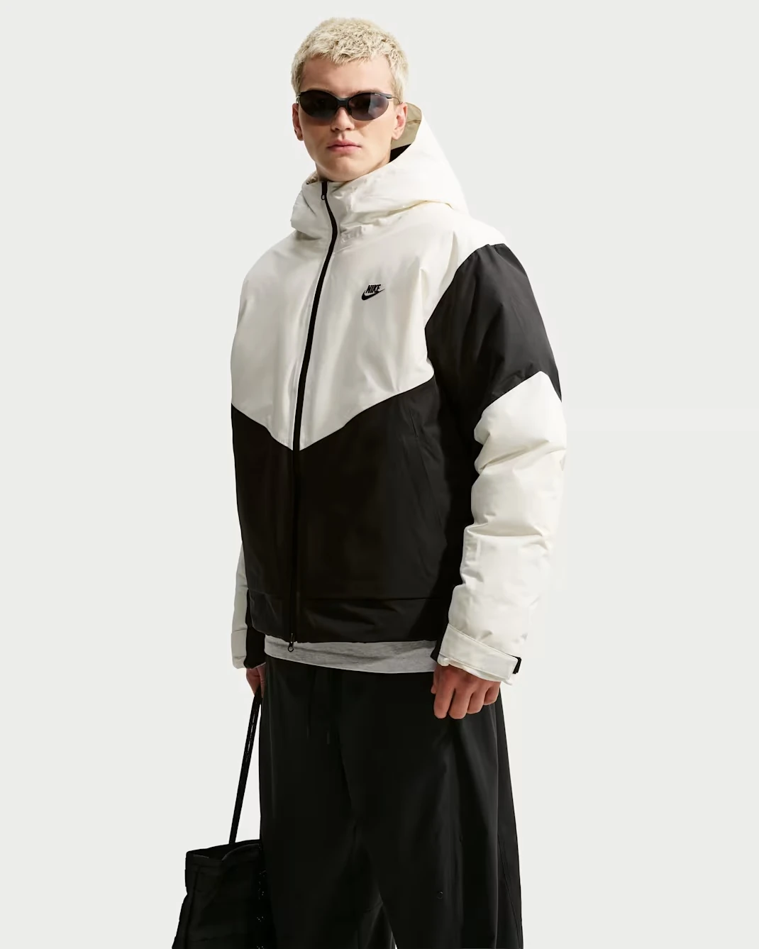 Nike Windrunner PrimaLoft hooded jacket in Sail and Black with color-blocked panels and black Nike Swoosh.