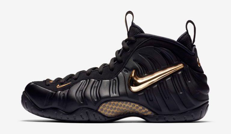 all black foams with gold nike sign