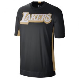 white & gold nike shirt